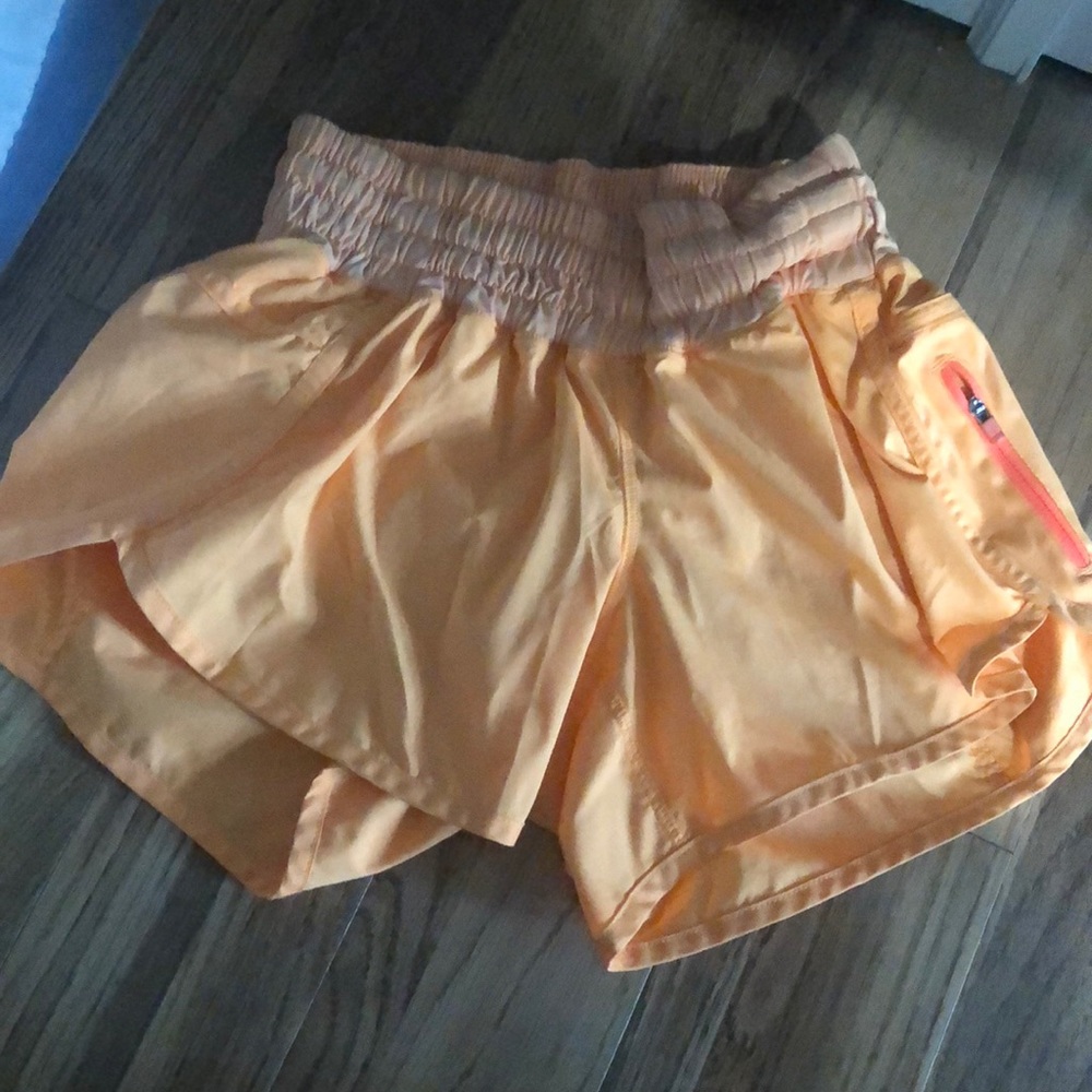 Orange lululemon tracker shorts